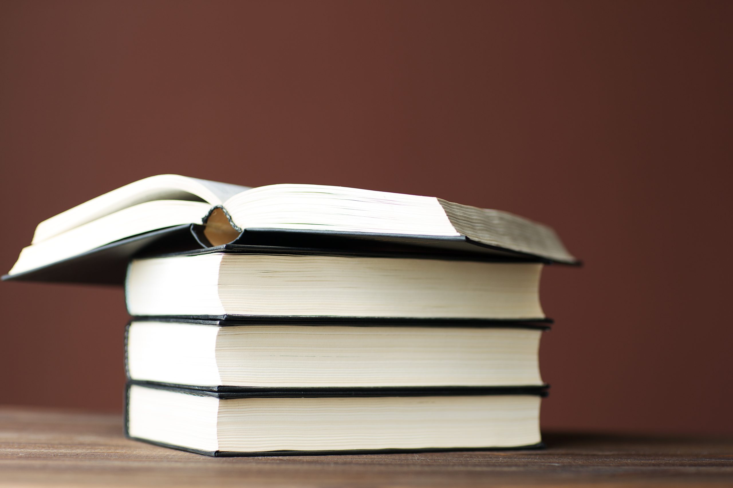 Four books stacked on top one another