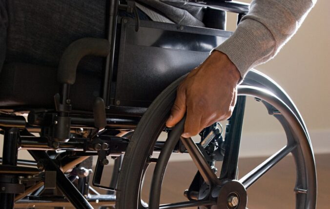 Unrecognisable man in a wheelchair